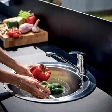 ENO Modulo Sink, outdoor kitchen cabinet, in stainless steel, black panels, cooking on patio, sink close up view