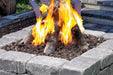 Close-up of Halo 44 gas fire pit with realistic log set and lava rocks.