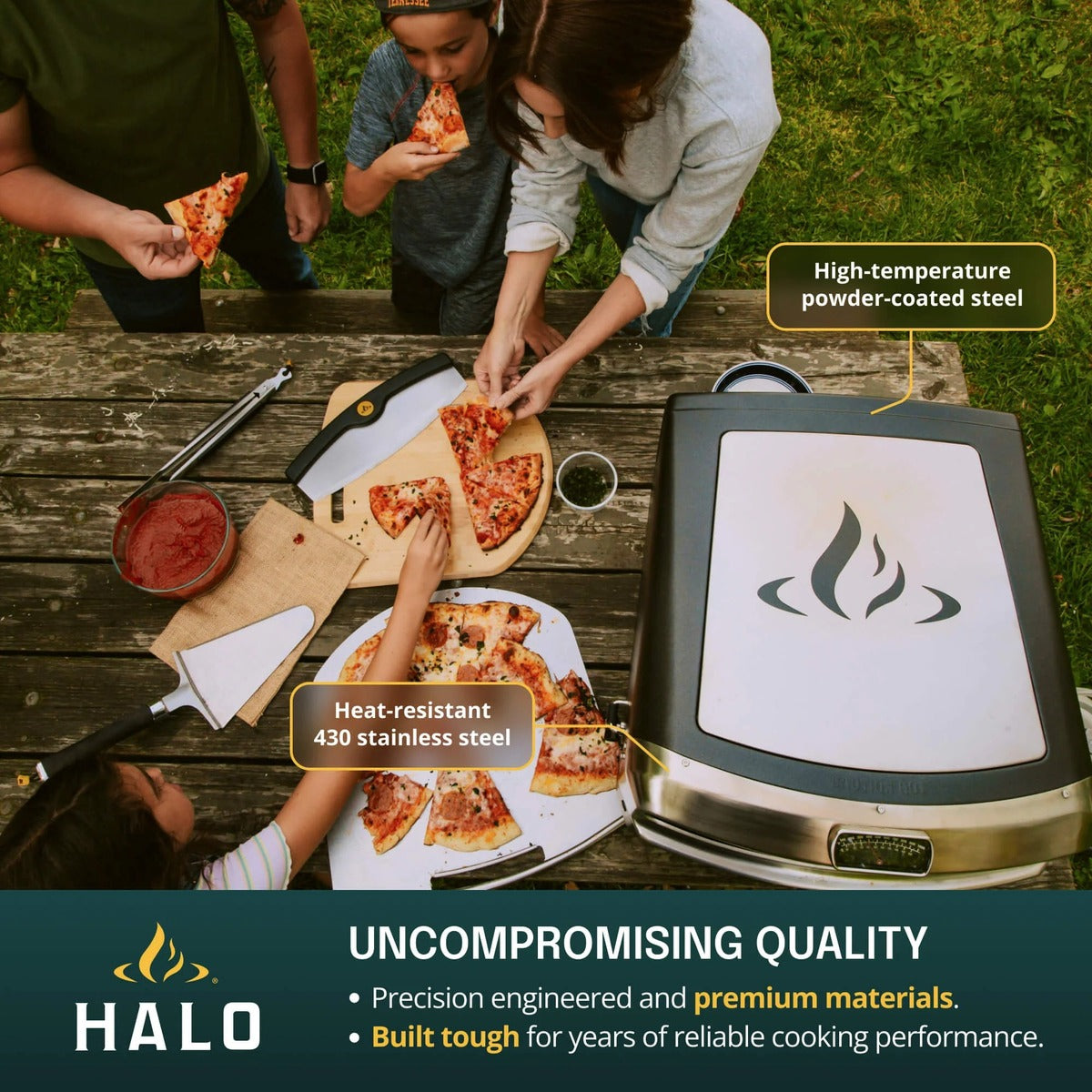 Halo Versa 16 Outdoor Pizza Oven with powder-coated steel body and stainless steel construction beside served pizza.