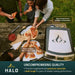Halo Versa 16 Outdoor Pizza Oven with powder-coated steel body and stainless steel construction beside served pizza.