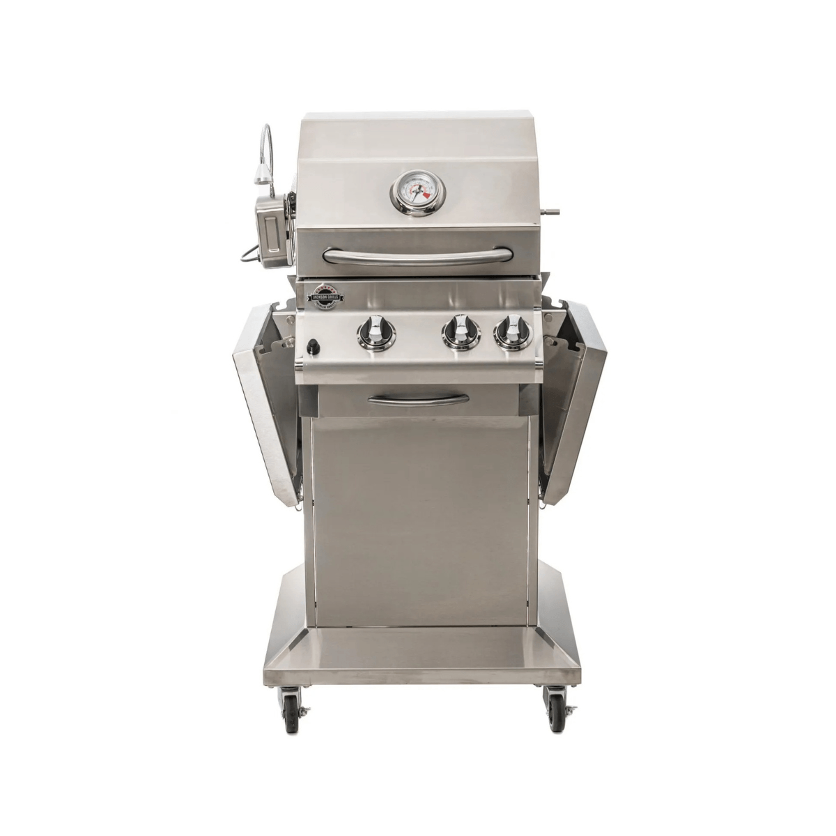 Front view of Jackson Grills 2-burner Lux Series gas grill with folded side shelves, stainless steel cart, temperature gauge, and locking caster wheels.