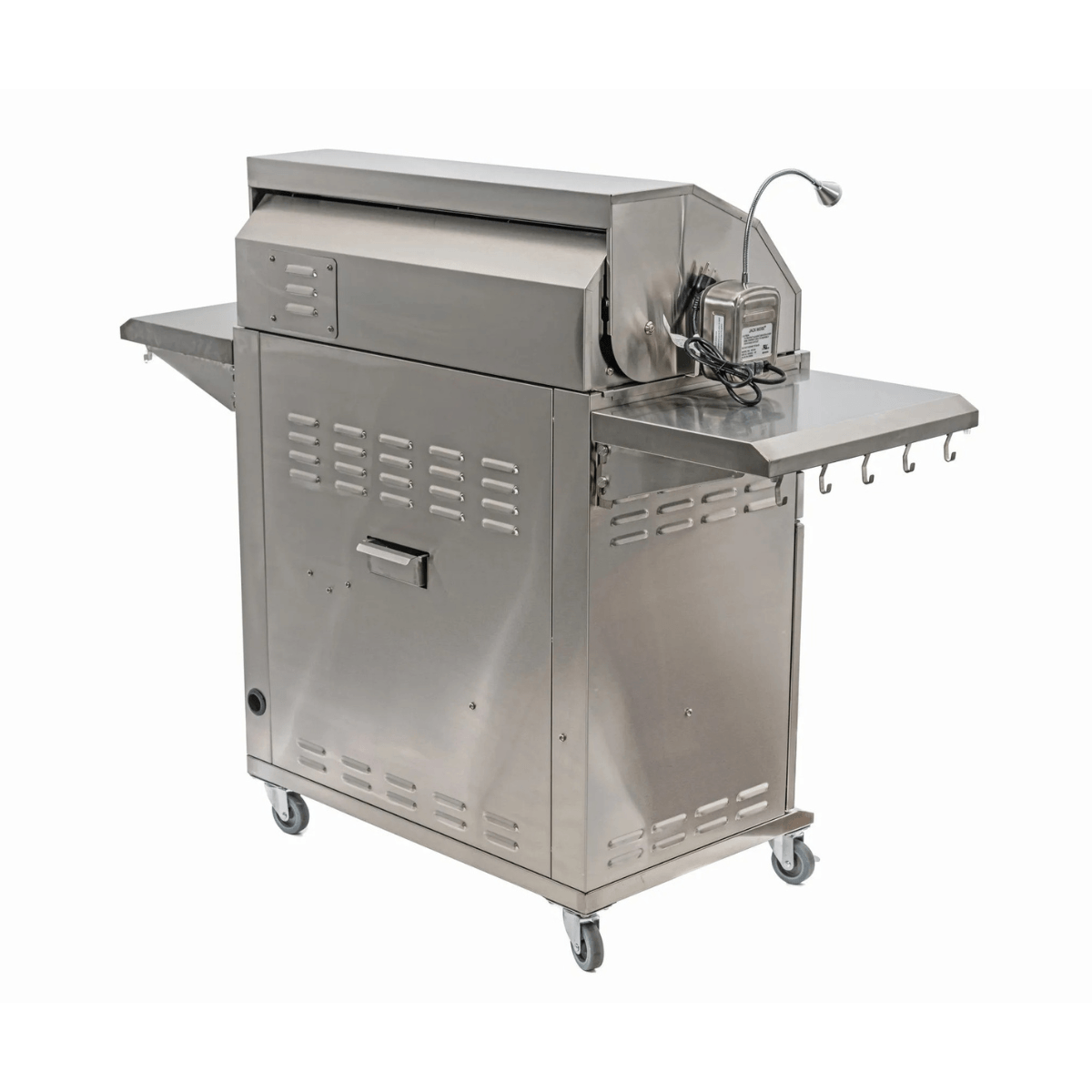 Rear angled view of Jackson Grills 4-burner Lux Series gas grill with stainless steel body, mounted grill light, and side shelf hooks.