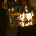 Jackson Grills Mountains West Fire Tall Table in use outdoors with active flames creating a warm gathering space.