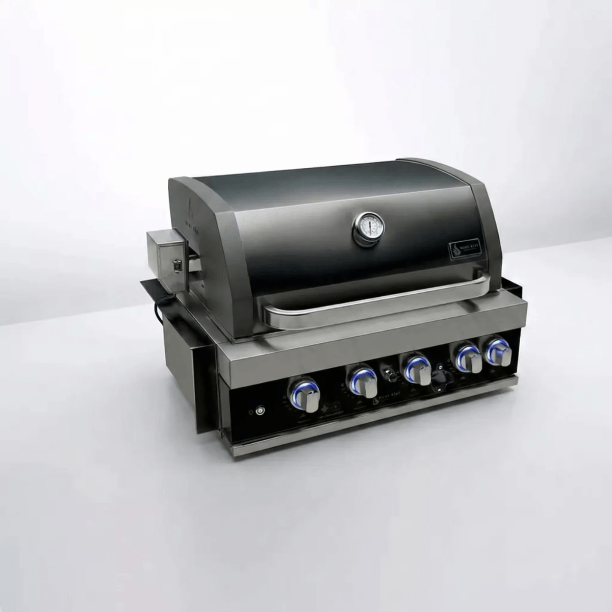 Angled view of the Mont Alpi 32-Inch Black Stainless Steel Built-In Grill featuring black stainless steel hood, stainless steel body, and illuminated control panel.