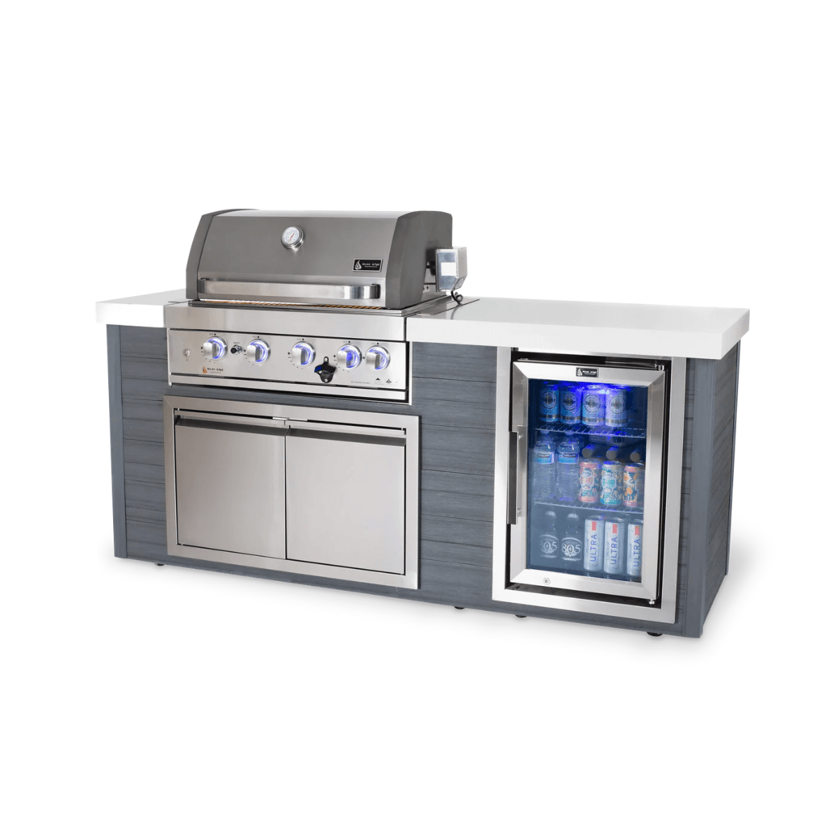 Three-quarter front view of the Mont Alpi 4-Burner Stainless Steel Art-wood Outdoor Island Grill showcasing illuminated controls, storage space, and beverage fridge.