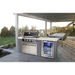 Mont Alpi 4-Burner Black Stainless Steel Art-wood Outdoor Island Grill installed in a covered outdoor kitchen, featuring a black stainless steel hood, beverage fridge, and spacious dining area.
