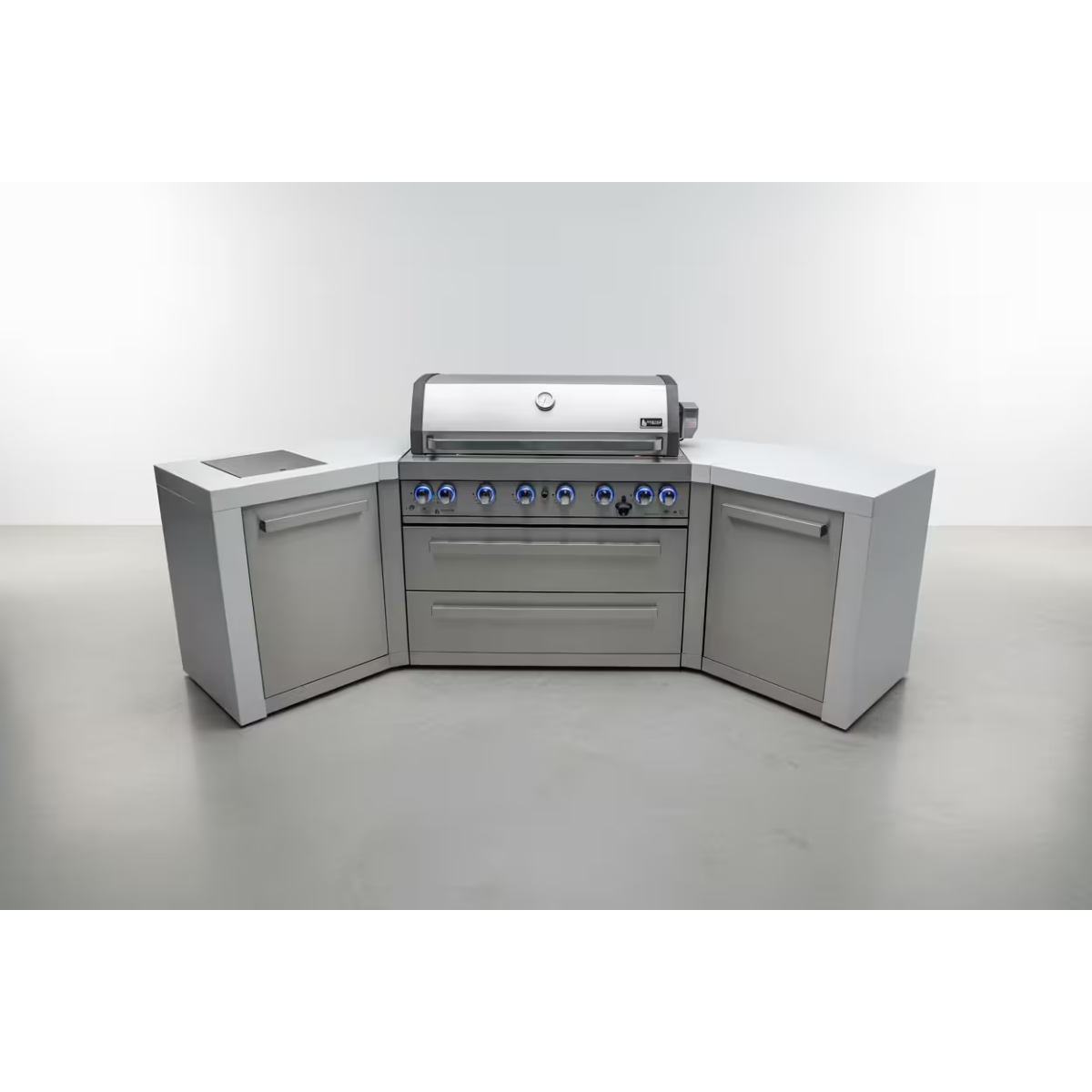 Front view of the Mont Alpi 400 Deluxe Island with closed grill hood, blue LED control knobs, dual 45-degree corner worktops, and integrated storage cabinets.