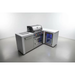Angled view of the Mont Alpi 400 Deluxe Island with 90-degree corner, built-in gas grill, fridge cabinet, storage door, and illuminated outdoor refrigerator.