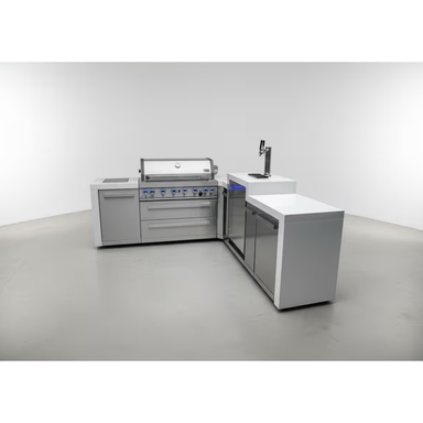 Wide perspective of the Mont Alpi 400 Deluxe outdoor kitchen featuring an L-shaped layout, integrated kegerator, gas grill, and spacious countertop workspace.