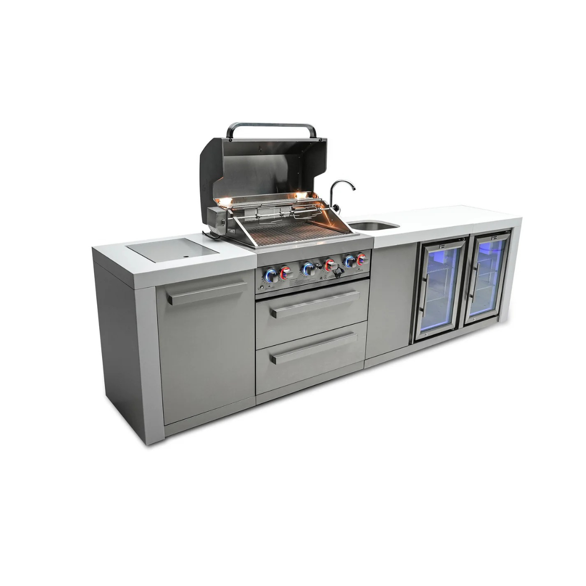 Angled view of the Mont Alpi 400 Deluxe Island with the grill hood open, revealing cooking grates, rotisserie system, integrated sink, and dual beverage refrigerators.