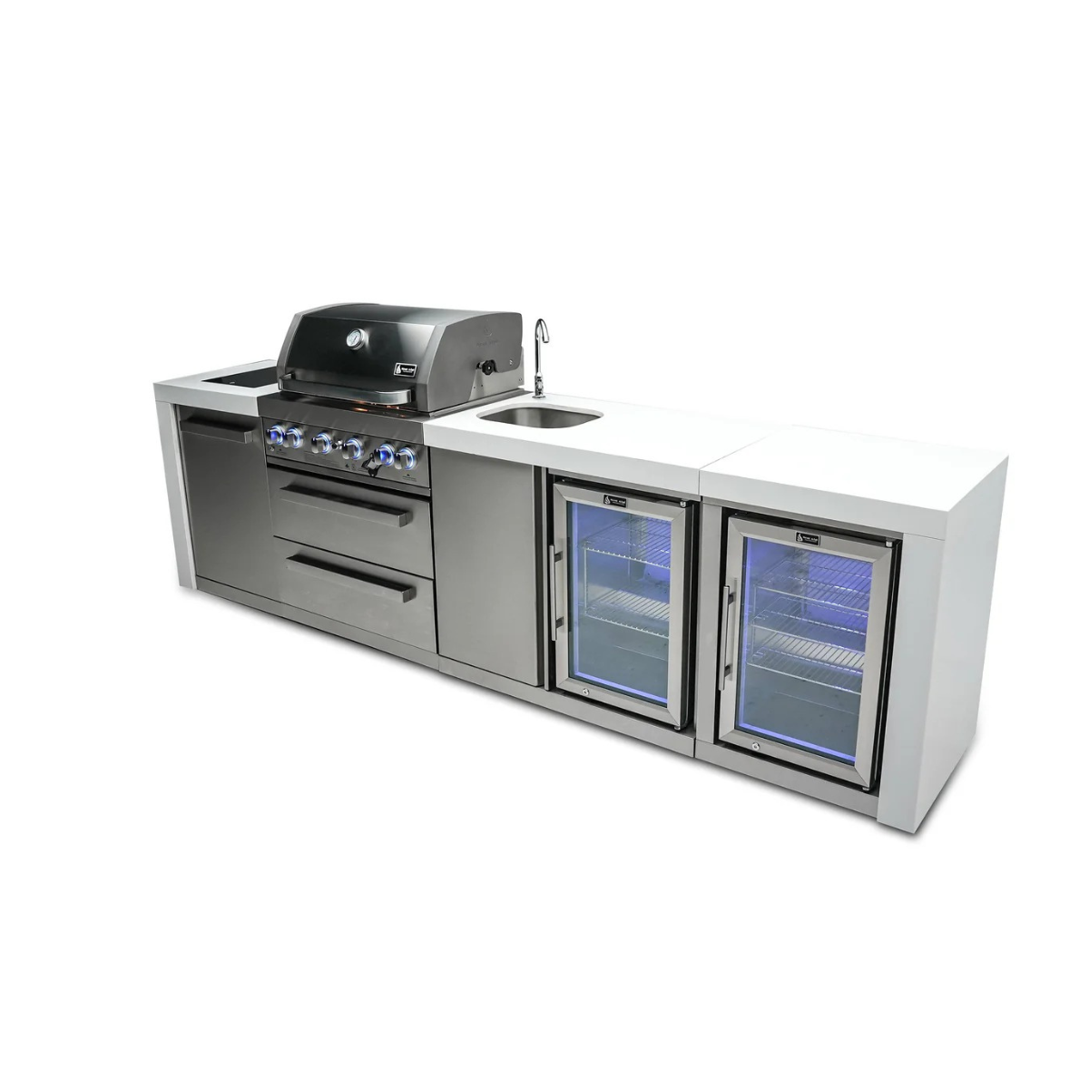 Rear angled view of the Mont Alpi 400 Deluxe Island with closed grill hood, sink station, storage drawers, and illuminated glass-door beverage coolers.