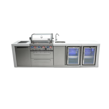 Front view of the Mont Alpi 400 Deluxe Island featuring a built-in gas grill, sink with faucet, storage cabinet, and dual glass-door beverage coolers.