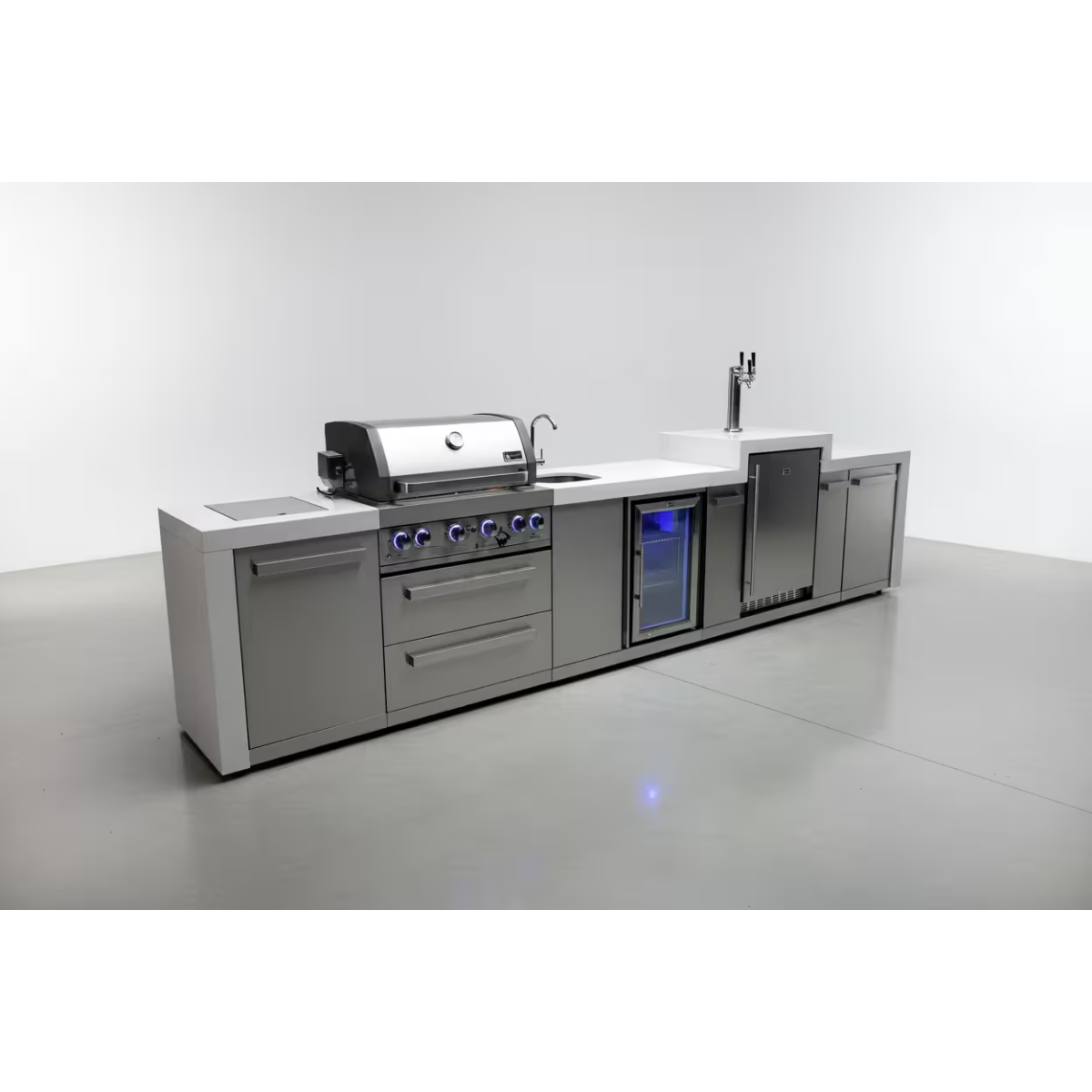 Studio view of the Mont Alpi 400 Deluxe Island with built-in grill, sink, beverage centre, kegerator, and spacious outdoor kitchen workspace.