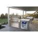 Mont Alpi 6-Burner Stainless Steel Art-wood Outdoor Island Grill installed under a covered patio, featuring a built-in fridge, storage cabinet, and spacious outdoor dining area.