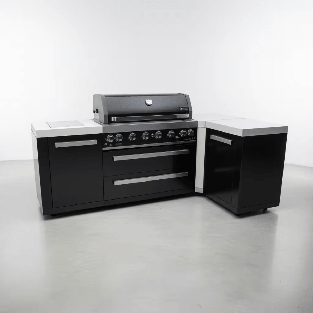 Angled view of the Mont Alpi 805 Black Stainless Steel Island showcasing the black stainless steel finish, spacious countertop surfaces, storage compartments, and premium outdoor kitchen layout.