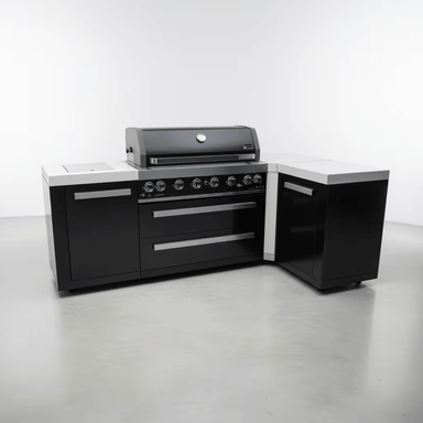 Angled view of the Mont Alpi 805 Black Stainless Steel Island showcasing the black stainless steel finish, spacious countertop surfaces, storage compartments, and premium outdoor kitchen layout.