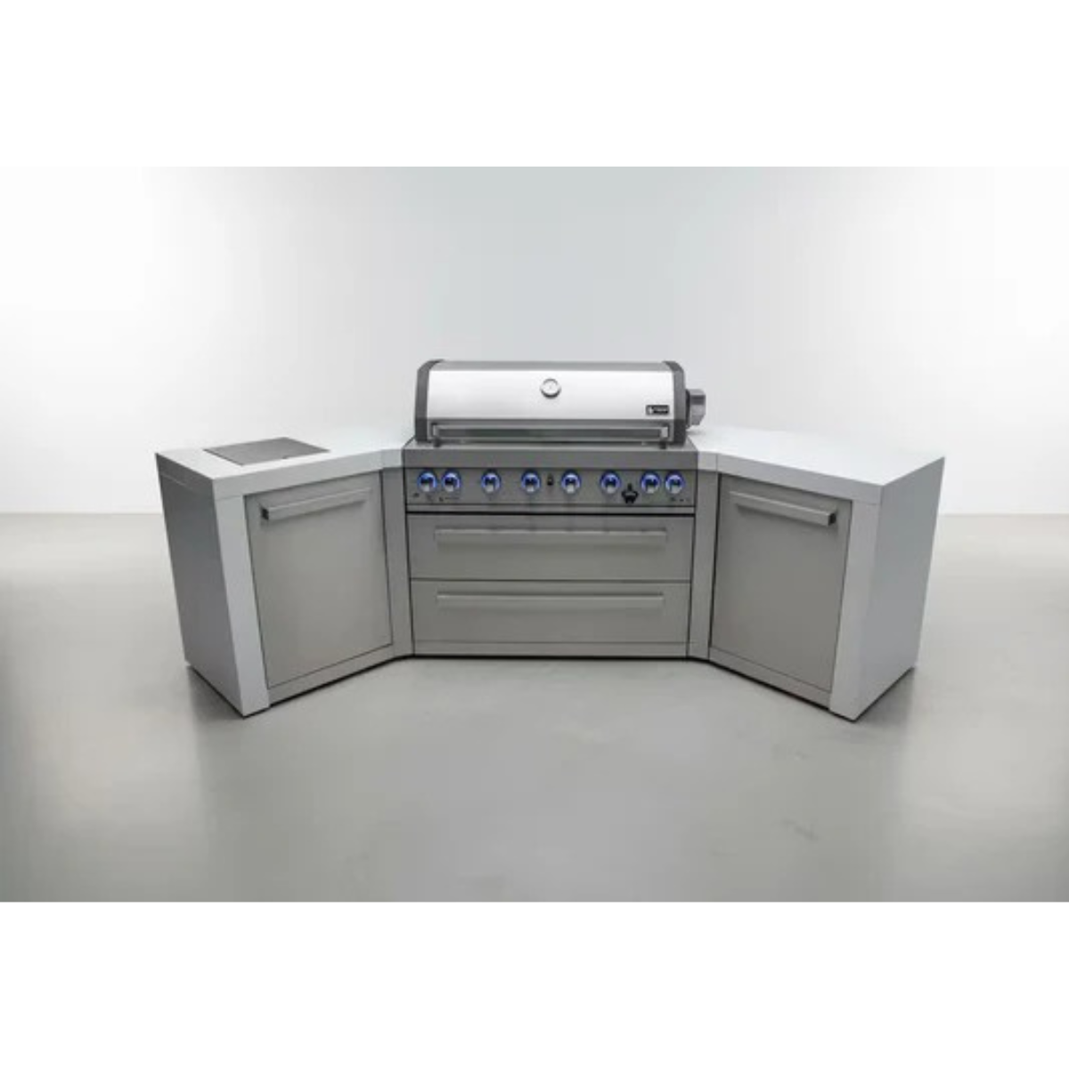 Front view of the Mont Alpi 805 Deluxe Island with 45-degree corners, featuring a stainless steel gas grill, double storage drawers, side cabinets, and illuminated control knobs.