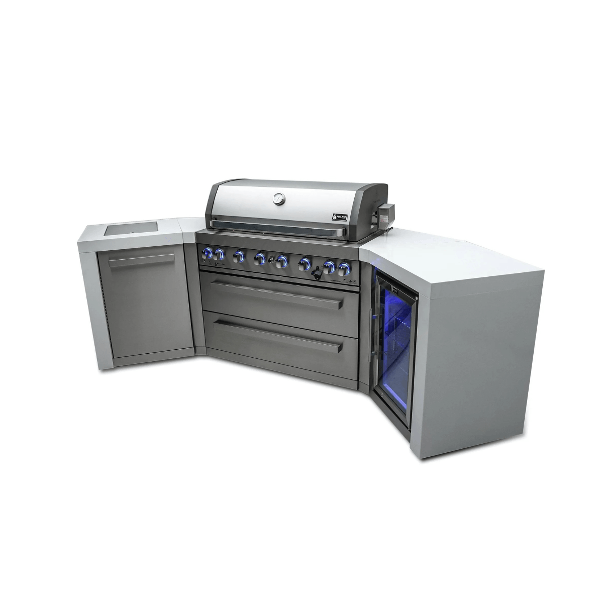 Three-quarter right-side view of the Mont Alpi 805 Deluxe Island featuring a closed gas grill, storage drawers, side cabinet, and outdoor fridge with blue interior lighting.