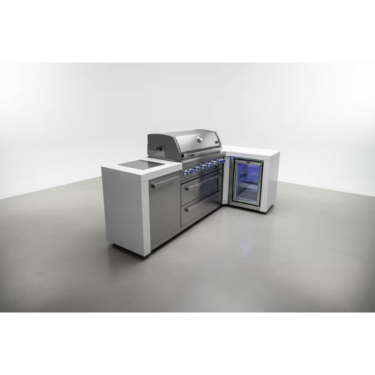 Studio view of the Mont Alpi 805 Deluxe Island with closed grill hood, stainless steel cabinetry, illuminated control knobs, and integrated outdoor refrigerator.