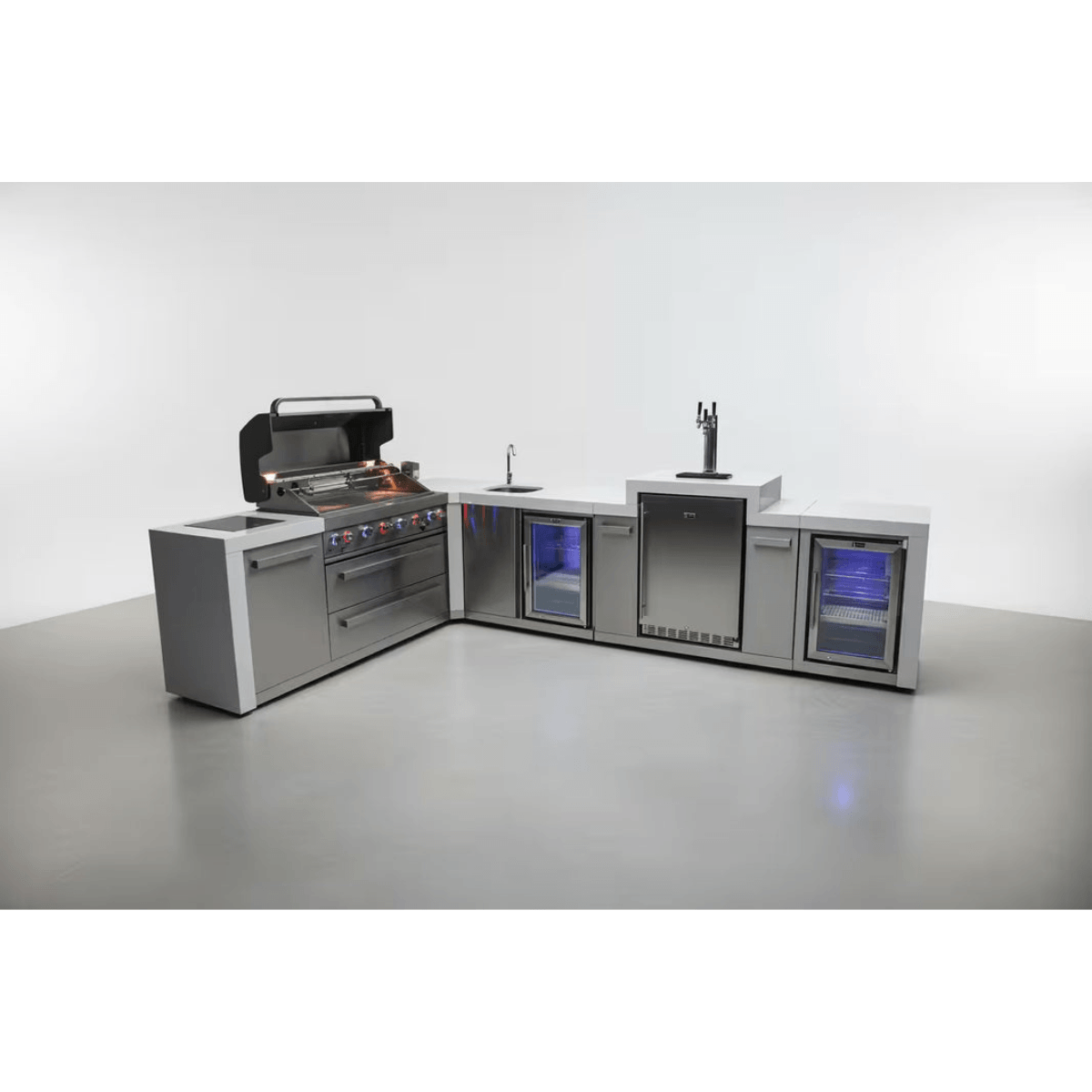 Mont Alpi 805 Deluxe Island with 90-degree corner layout, open grill, kegerator, beverage centre, sink, and fridge cabinet in a studio setting.