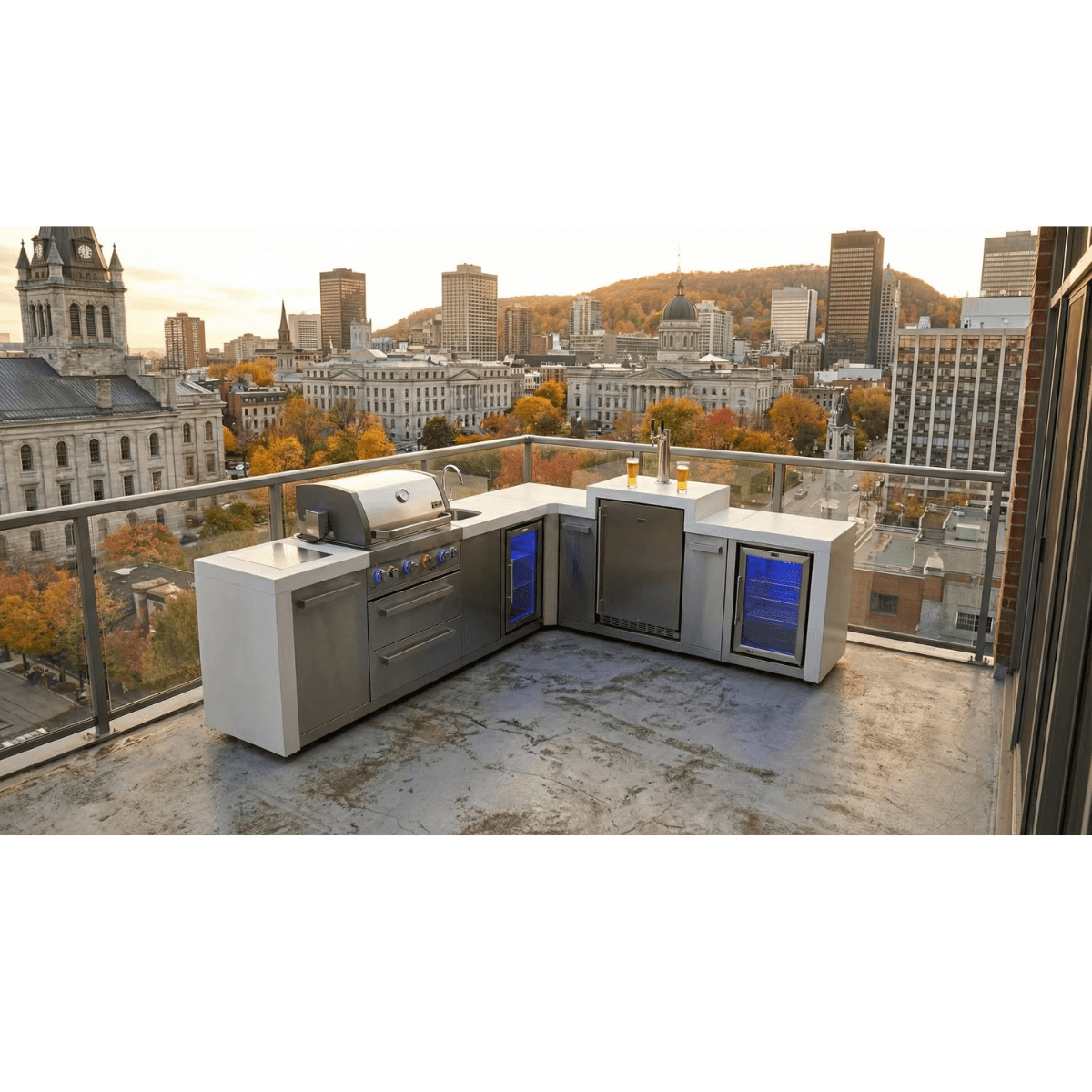L-shaped Mont Alpi 805 Deluxe Island with kegerator, beverage centre, and fridge cabinet on a rooftop terrace overlooking a city skyline.