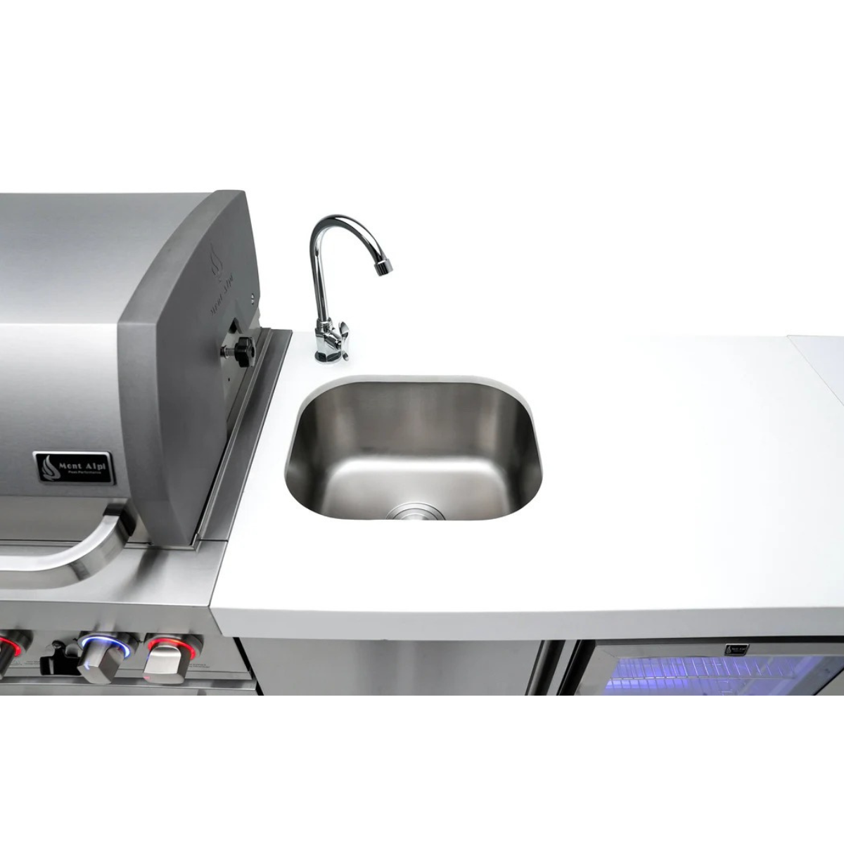 Close-up of the stainless steel sink and faucet integrated into the Mont Alpi 805 Deluxe Island countertop beside the beverage center.