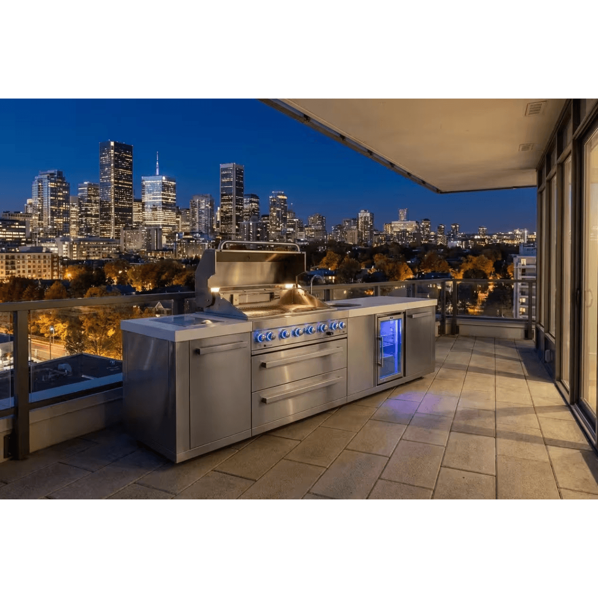 Perspective view of the Mont Alpi 805 Deluxe Island with open grilling area, kegerator, and spacious countertop workspace.
