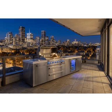 Perspective view of the Mont Alpi 805 Deluxe Island with open grilling area, kegerator, and spacious countertop workspace.