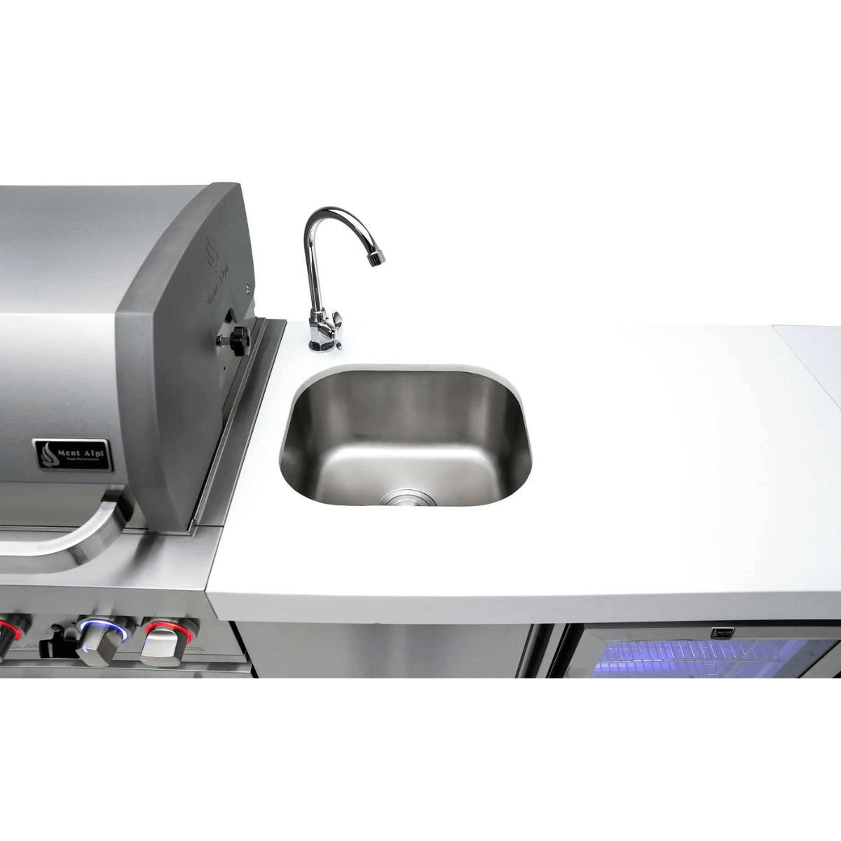 Stainless steel Mont Alpi 805 Deluxe Island with kegerator on a rooftop terrace overlooking a city skyline at night.