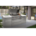Mont Alpi 805 Deluxe Island installed in a luxury outdoor patio setting with the grill hood open and integrated storage, kegerator, and fridge cabinet.