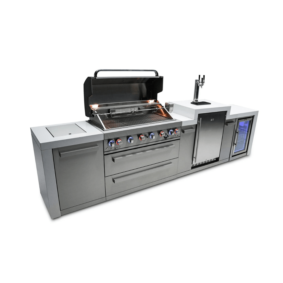 Angled view of the Mont Alpi 805 Deluxe Island with the grill hood open, highlighting the cooking surface, LED-lit control knobs, kegerator, and fridge cabinet.
