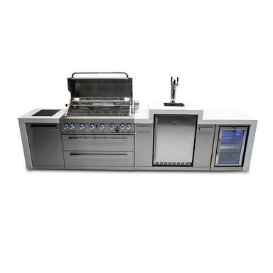 Front view of the Mont Alpi 805 Deluxe Island with the grill lid open, featuring a kegerator, fridge cabinet, storage drawers, and illuminated cooking area.