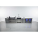 Wide front view of the Mont Alpi 805 Deluxe Island displaying the complete outdoor kitchen setup with grill, kegerator, sink, beverage center, storage cabinets, and dual refrigerators.