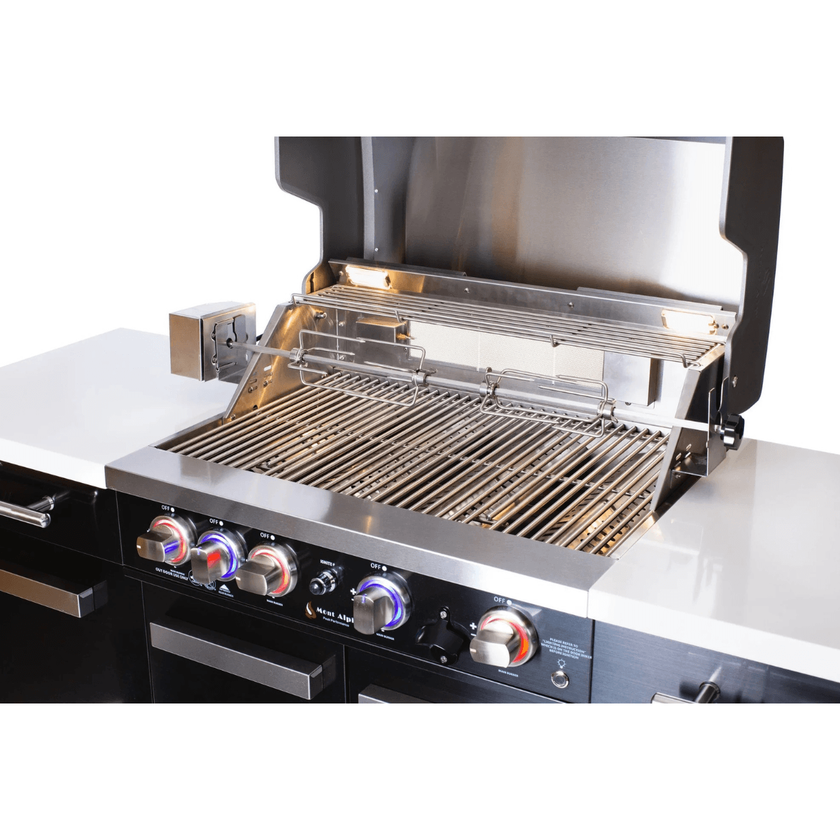 Close-up of the Mont Alpi 957 Black Stainless Steel Island grill area with stainless steel cooking grates, rotisserie system, and illuminated burner controls.