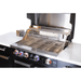 Close-up of the Mont Alpi 957 Black Stainless Steel Island grill area with stainless steel cooking grates, rotisserie system, and illuminated burner controls.