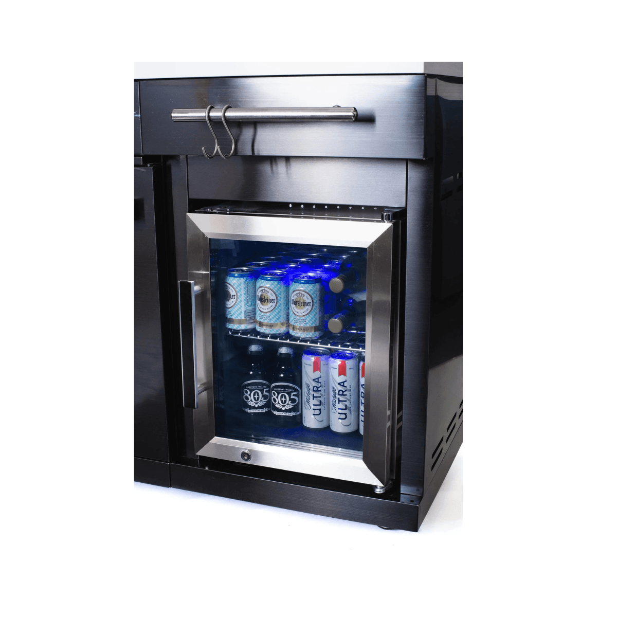 Close-up of the built-in compact refrigerator on the Mont Alpi 957 Black Stainless Steel Island stocked with beverages and featuring a glass door.
