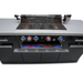 Front view of the Mont Alpi 957 Island with open grill hood, cooking grates, rotisserie system, and illuminated control knobs.