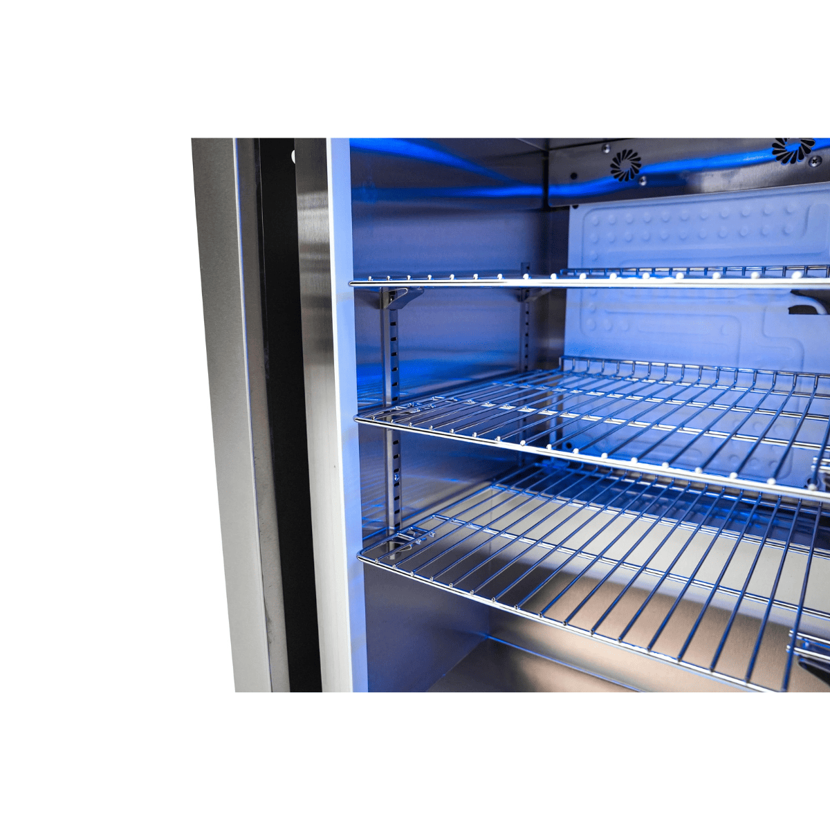 Adjustable wire shelving inside the Mont Alpi Black Stainless Steel Fridge Cabinet Module with blue LED lighting.