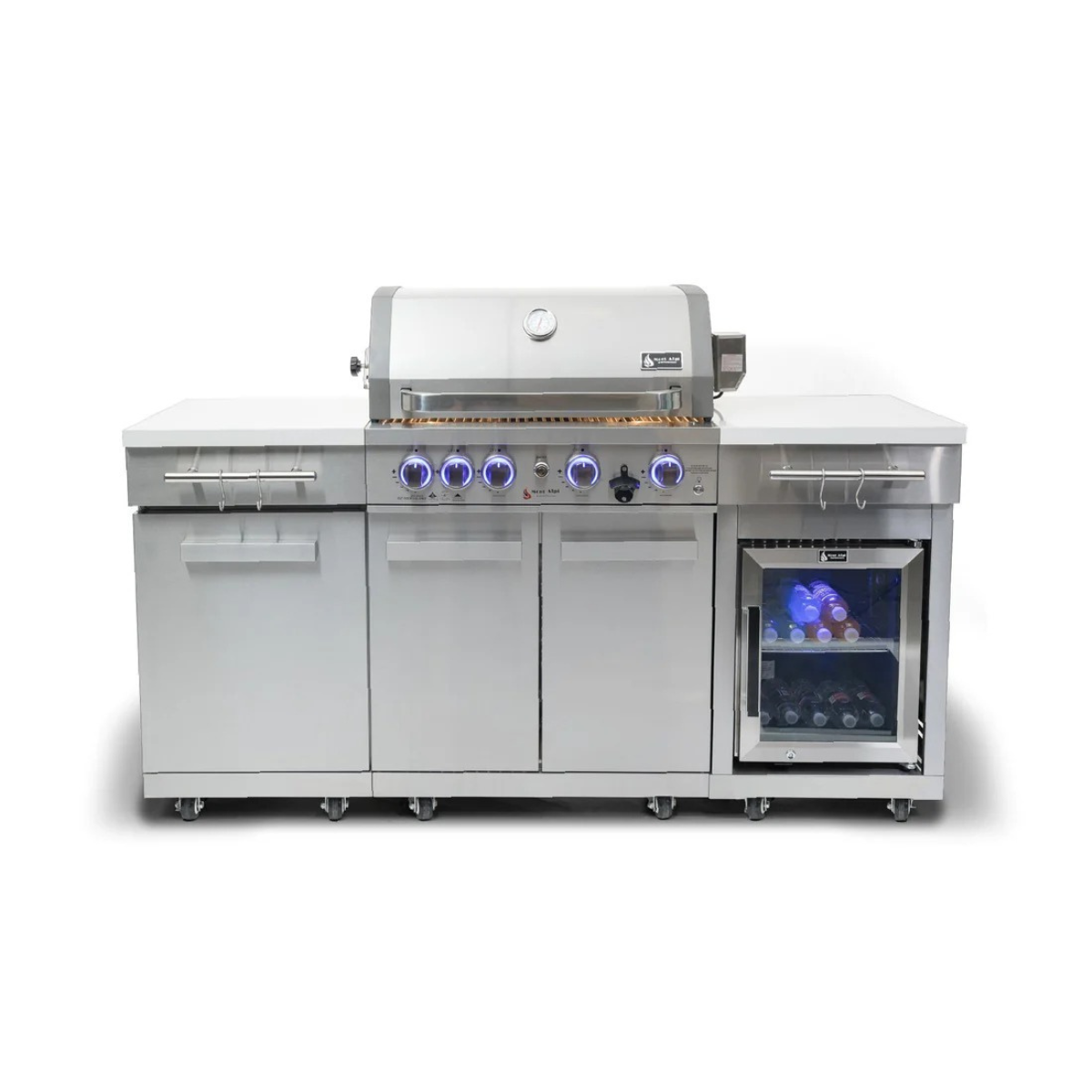 Front view of the Mont Alpi Compact Island with Refrigerator showcasing LED-lit control knobs, storage cabinets, side tool hooks, and a glass-door beverage fridge.