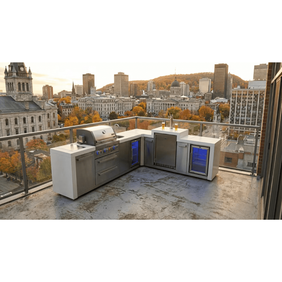 Mont Alpi Compact Island with Refrigerator installed on a rooftop terrace, featuring a stainless steel grill, sink, beverage tap, and dual outdoor refrigerators.