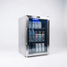 Three-quarter view of the Mont Alpi stainless steel outdoor refrigerator with illuminated interior, glass door, and organised beverage storage.