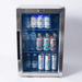 Front view of the Mont Alpi outdoor fridge displaying drinks, wine bottles, and water on adjustable shelves behind a glass door with blue LED lighting.