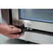 Close-up of the Mont Alpi outdoor fridge lock and key system on a stainless steel glass door for secure beverage storage.