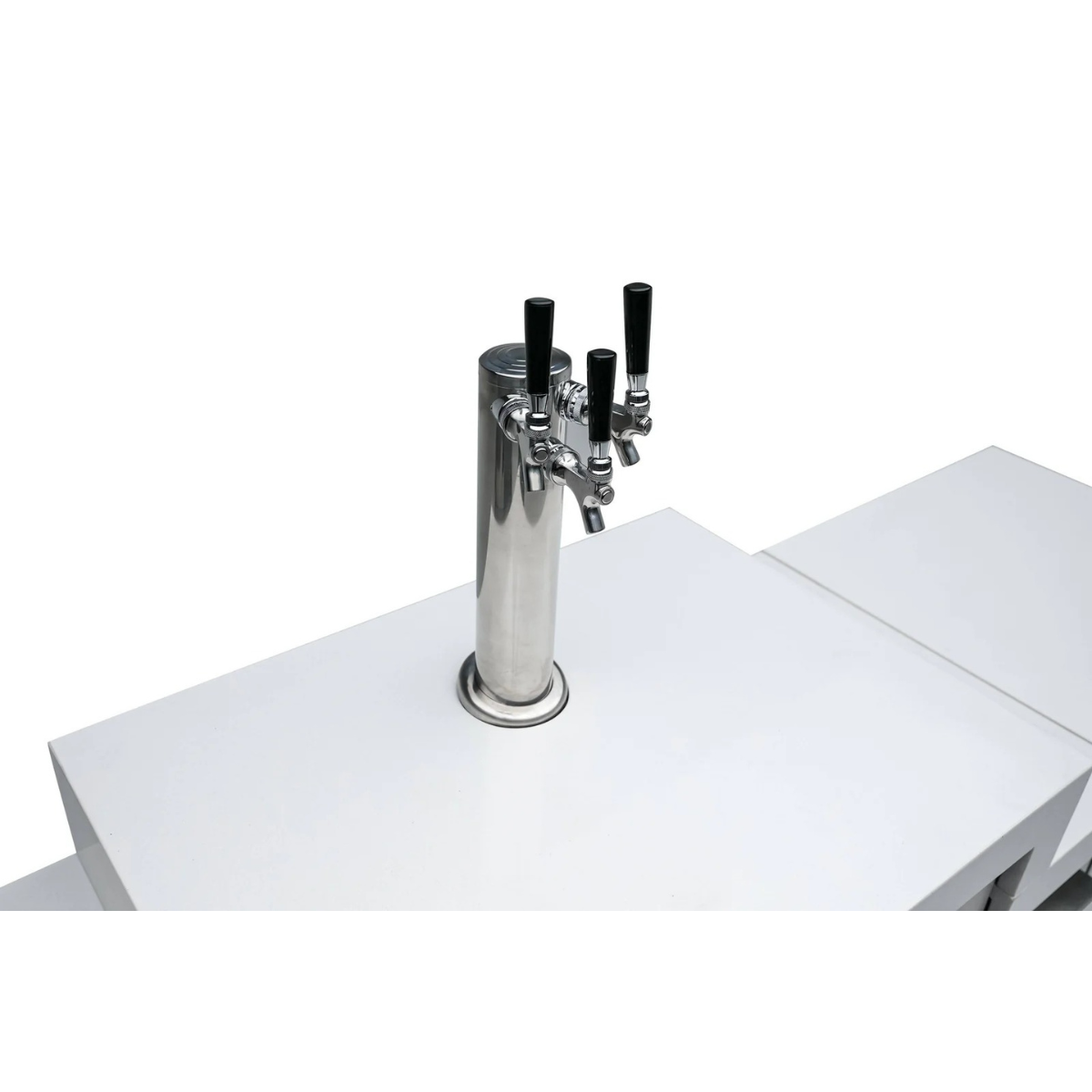 Close-up of the stainless steel triple beer tap tower mounted on the Mont Alpi Kegerator countertop.