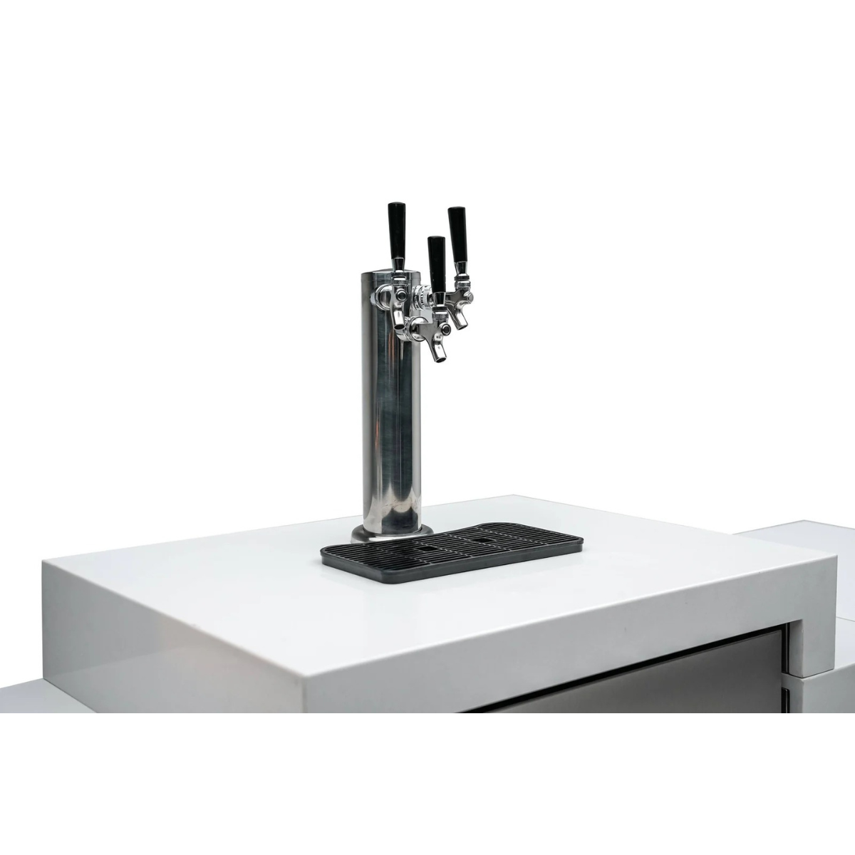 Angled close-up of the stainless steel triple tap dispenser and drip tray on the Mont Alpi Kegerator.