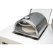 Built-in Mont Alpi universal side burner pizza oven installed in an outdoor kitchen countertop with glass door, thermometer, and pizza stone visible inside.