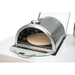 Open-door view of the Mont Alpi universal side burner pizza oven revealing the ceramic pizza stone and stainless steel cooking chamber.
