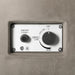 Avalon concrete fire pit control panel with igniter and adjustable flame settings.