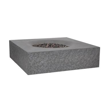 Angled view of the Pyromania Monument square concrete fire table with lava rocks.